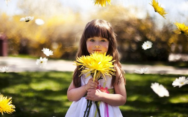 cute-little-girl-holding-yellow-flower